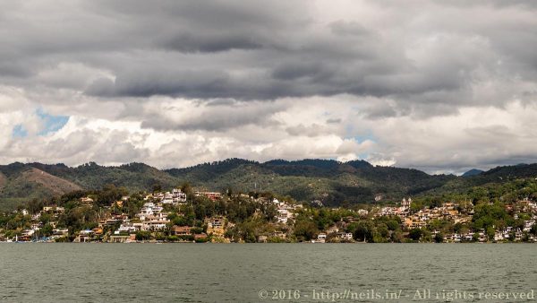 From the water looking back at Valle de Bravo ominous skies